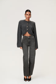 Woman wearing a Cessole cardigan in a gray textured knit, Adoore signature buttons, wide sleeves and cropped fit. thumbnail image