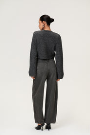 Woman wearing a Cessole cardigan in a gray textured knit, Adoore signature buttons, wide sleeves and cropped fit. thumbnail image