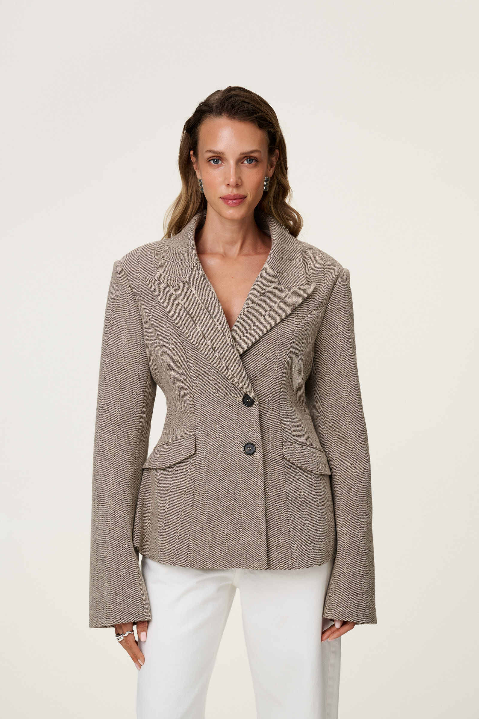 brown tweed blazer with buttons in the front and padded shoulders, fitted waist and long arms image