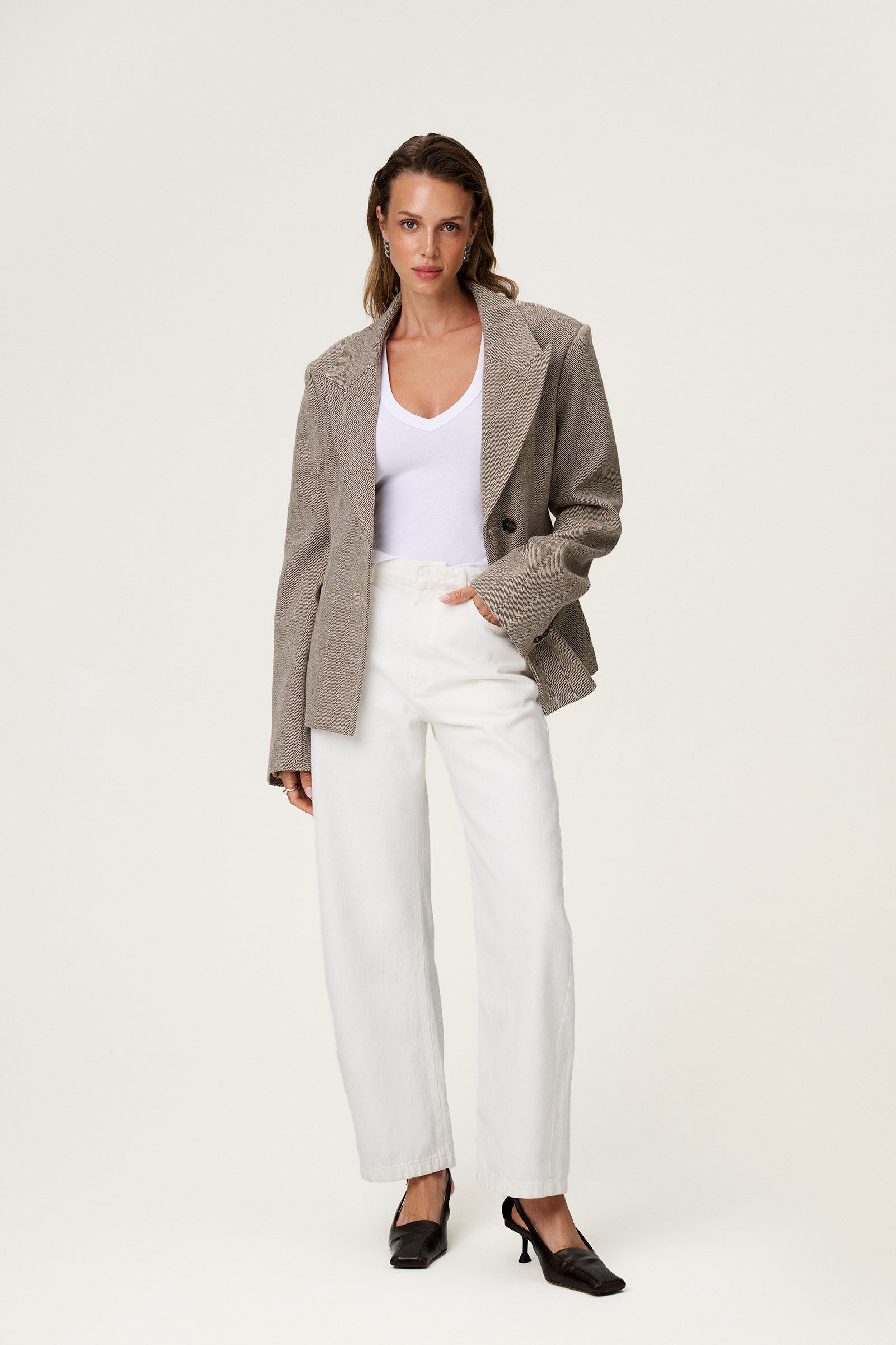 brown tweed blazer with buttons in the front and padded shoulders, fitted waist and long arms image