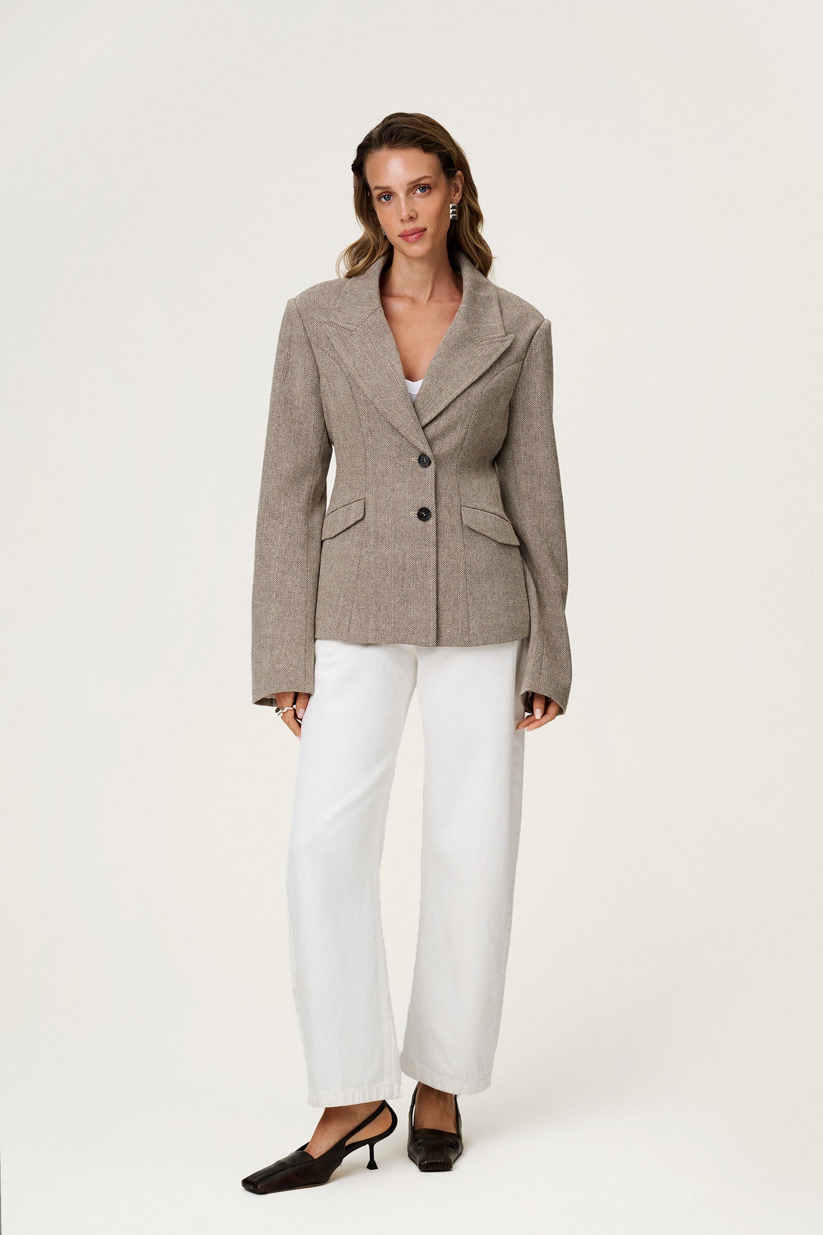 brown tweed blazer with buttons in the front and padded shoulders, fitted waist and long arms image